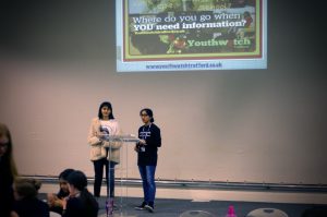 Ahona & Hania presenting to the crowd at the 'Trafford let's talk youth' event
