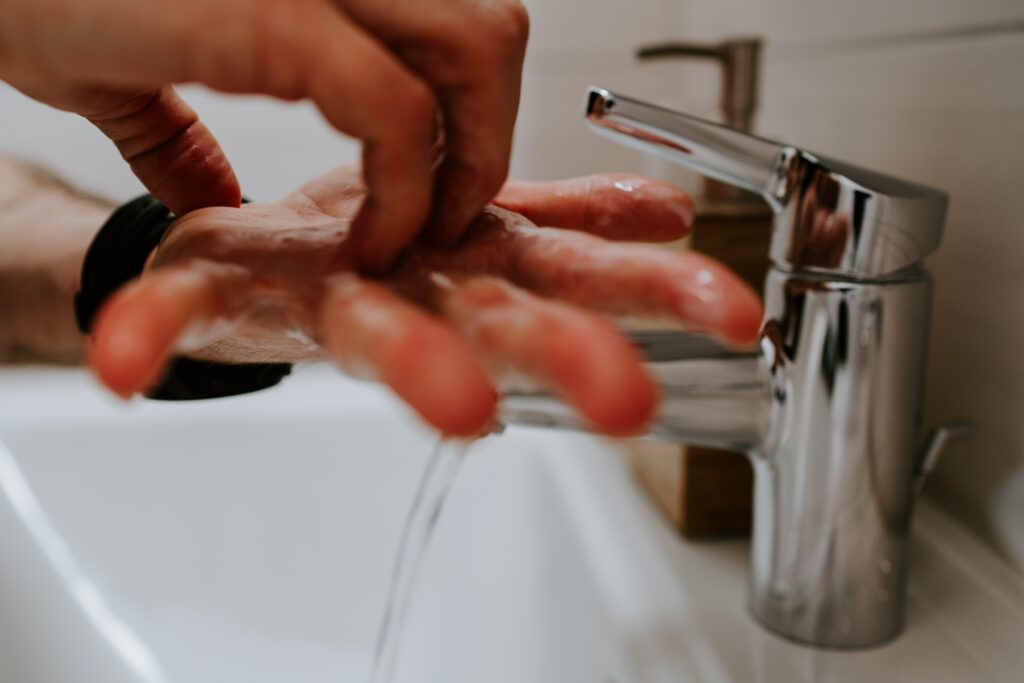 Up-close photo of someone washing their hands